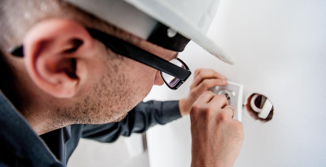Electrician Performing Annual Electrical Maintenance